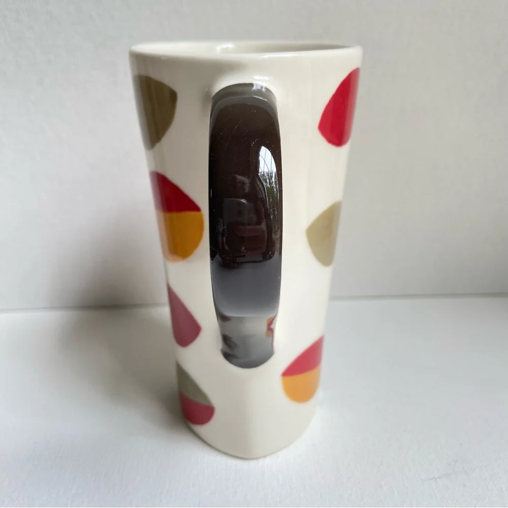 Pier 1 tall asymmetrical oval coffee mug with abstract fall leaves and stripes